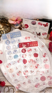 Macro shot of 3D crystal epoxy rose stickers with vintage gold foil embossing motifs