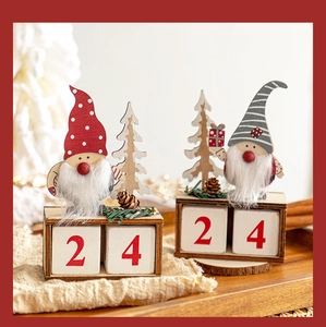 Detail of wooden Christmas gnome countdown calendar with numbered blocks and pine cones