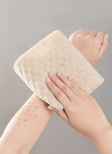 Close-up of extra-long exfoliating back scrubber with thick textured weave for deep cleansing