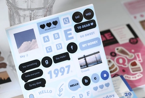 Detail of blue INS style deco stickers with English phrases for DIY journaling