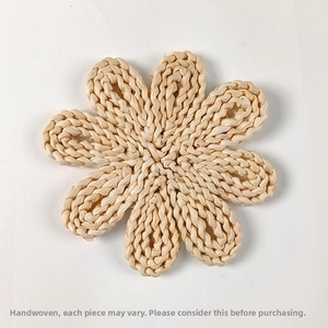 Detailed top view of a handmade flower-shaped woven corn husk heat-resistant placemat