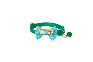 Detail of green plaid pet collar with bowknot, golden bell and durable safety buckle