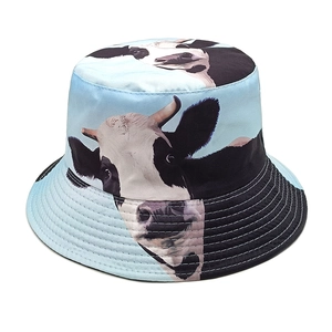Detail of light blue cotton bucket hat with cow print and reinforced stitched brim