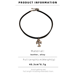 Detail view of the black leather choker featuring a vintage silver alloy cross pendant