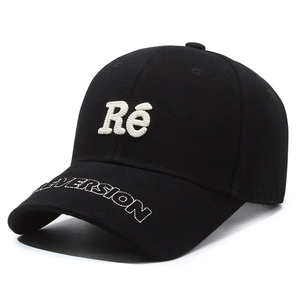 Classic black baseball cap featuring 3D towel embroidery and flat letter brim detail