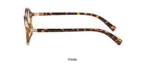 Detailed side view of tortoise shell glasses frame with gold pyramid rivet accents