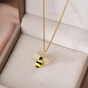 Golden alloy bee pendant necklace with yellow black stripes on a cross chain in a gift box