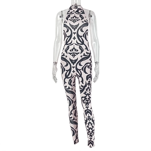 Detail of high neck black and white damask print jumpsuit in stretchy fabric