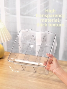 Detailed view of clear 9-grid acrylic organizer box with lid for beads and jewelry