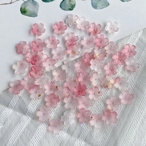 Dual-color gradient resin flower beads in pink and white with gold accents for jewelry