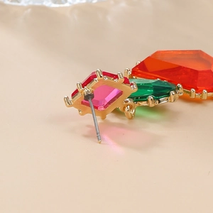 Macro shot of colorful rhinestone earrings showing secure gold-plated back and studs