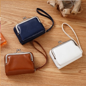 Vintage PU leather coin purses with metal clasps in navy, brown, and white colors