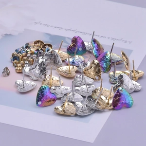 Detailed view of heart-shaped 304 stainless steel studs with quilted texture and DIY hanging hole