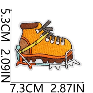 Detail of yellow hiking boot embroidered patch with 7.3cm and 5.3cm size indicators