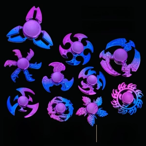 Macro view of ten colorful electroplated metal hand spinners in blue-purple gradient finish