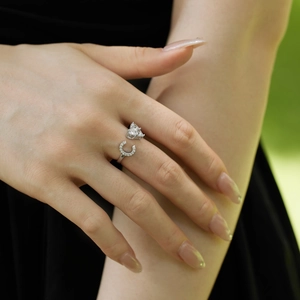 Close-up of S925 silver adjustable ring with heart and C-shaped zircon on a finger