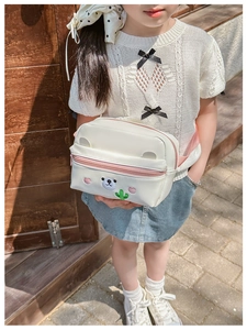 Detail of cute bear and cactus embroidery on white PU leather children crossbody bag