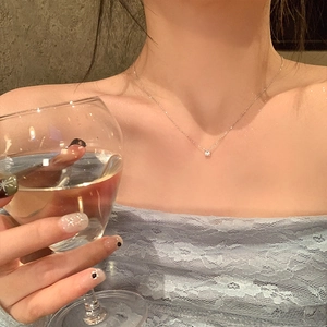 Elegant S925 sterling silver solitaire crystal necklace worn by a female model
