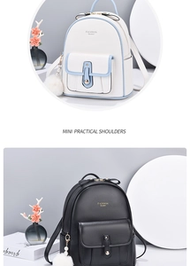 Detail of mini leather backpacks in light blue and black with pearl fur ball charms