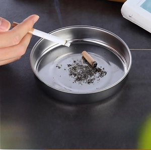 Close-up of heart-patterned stainless steel mosquito coil holder with geometric hollow lid