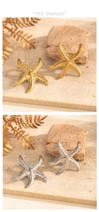 Detail view of starfish stud earrings in gold and silver finish with realistic texture