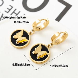Detail view of 18K gold plated butterfly hoop earrings with black shell inlay on white card