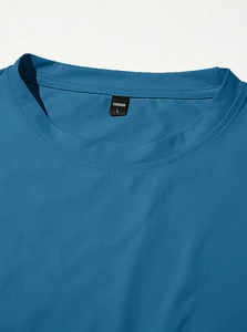 Detailed close-up of the dark blue crew neck t-shirt with fashion label and size L