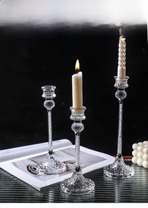 Detail of crystal glass candle holders with internal crushed diamond effect and vintage base
