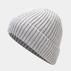 Close-up of the light gray knitted beanie showing fine texture and ribbed cuff detail