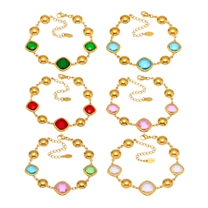 Gold plated stainless steel bracelets with faceted crystals in various vibrant colors