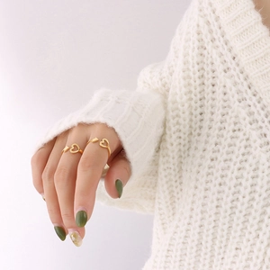 Minimalist 18K gold plated heart arrow open rings set worn on hand with white knit sweater