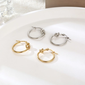 Minimalist polished stainless steel knot hoop earrings in gold and silver finishes