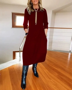 Detail view of the elegant wine red round neck and long sleeve midi dress fabric