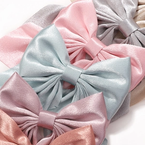 Five-piece set of glossy satin bow hair clips in vibrant solid colors for girls
