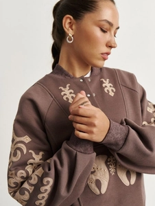 Brown half-zip sweatshirt with beige floral embroidery and high-waist straight pants set