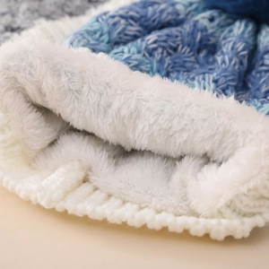 Winter knit hat for kids with thick white fleece lining in blue and white gradient