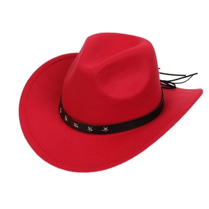 Detail of red western cowboy hat featuring black leather band with silver star rivets