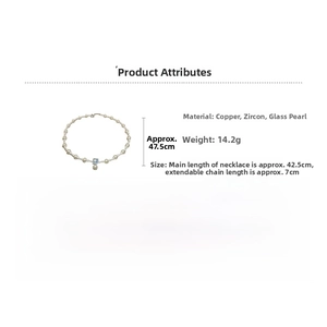 Detail of elegant gold-plated necklace with white glass pearls and blue zircon pendant