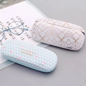 Portable geometric pattern eyewear case in mint green and minimalist white designs