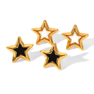 Gold stainless steel star stud earrings with black and white enamel fill on white background