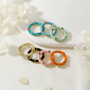 Set of minimalist gold-plated rings with colorful enamel drip and zircon inlay