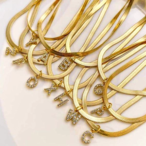 Gold plated snake chain necklace with sparkling crystal initial letter pendants for women