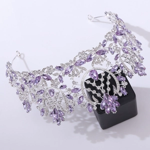 Close-up of luxury bridal tiara with purple crystals and sparkling silver rhinestones
