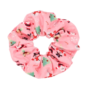 Detailed macro view of pink Christmas scrunchie with Santa and snowman cartoon patterns