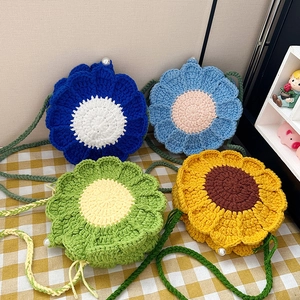 Stylish floral handmade knit crossbody bags in four vibrant colors on a plaid background