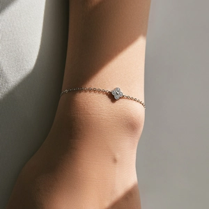 Chic S925 sterling silver four-leaf clover bracelet with sparkling pavé crystals on wrist