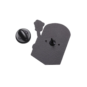 Detailed macro view of the metal pin back and black rubber clutch backing for badges