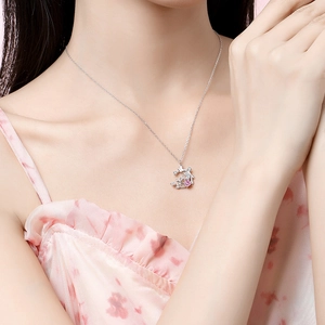 Elegant S925 silver necklace with pink floral gemstone pendant on a model