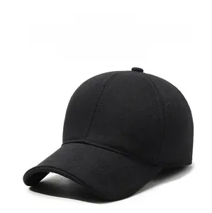 Close-up of black wool winter baseball cap with thick warm lining and sports embroidery