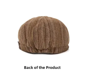 Detailed back view of a brown striped knit newsboy cap with textured weaving and metal pin